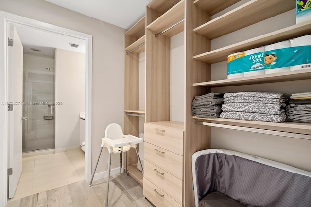 walk in closet featuring light wood-type flooring