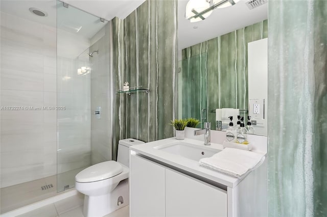 bathroom with vanity, tile patterned flooring, a shower with door, and toilet