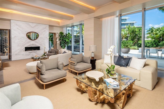 living room with a fireplace and beam ceiling