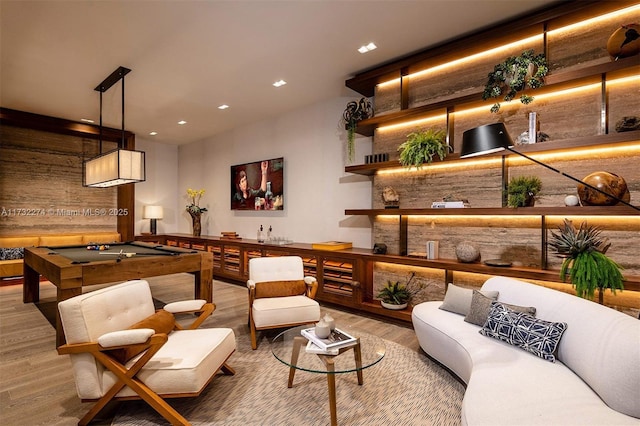 interior space featuring billiards, wood-type flooring, and hanging light fixtures