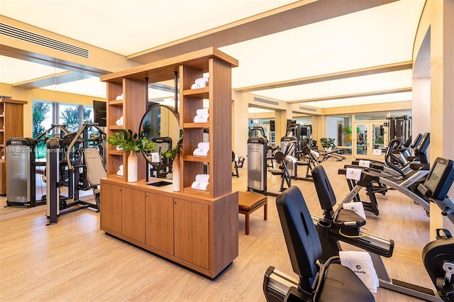 workout area with light wood-type flooring