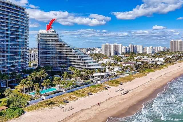 aerial view featuring a view of the beach and a water view