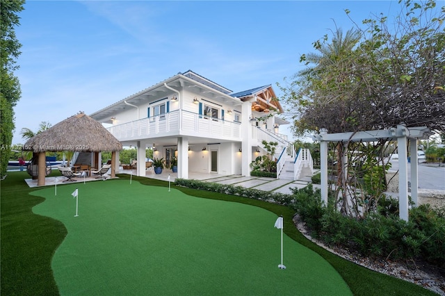 surrounding community with a gazebo and a patio