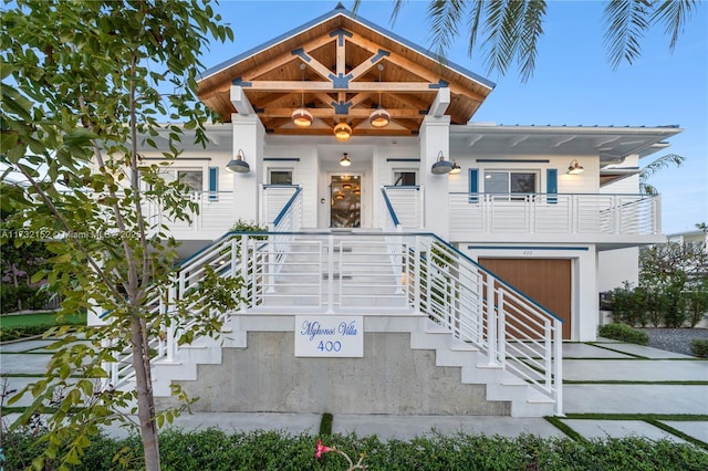 view of front of property featuring a garage and covered porch