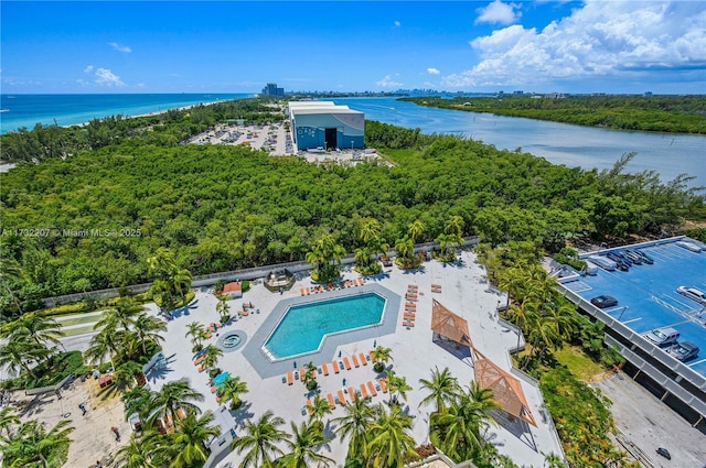 birds eye view of property with a water view