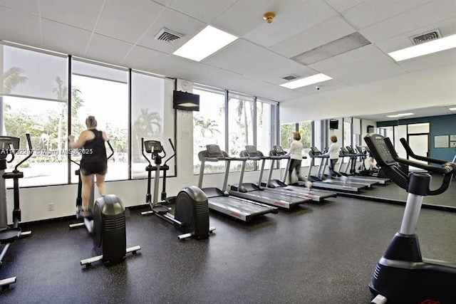 workout area with a paneled ceiling