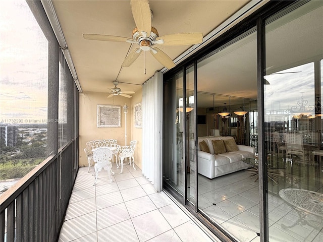 sunroom / solarium with ceiling fan