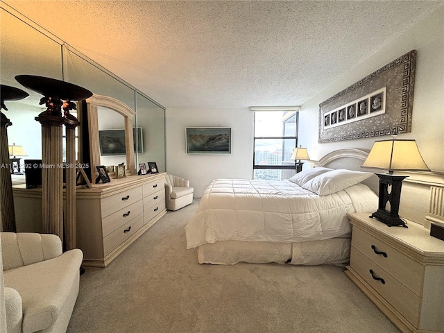 carpeted bedroom with a textured ceiling