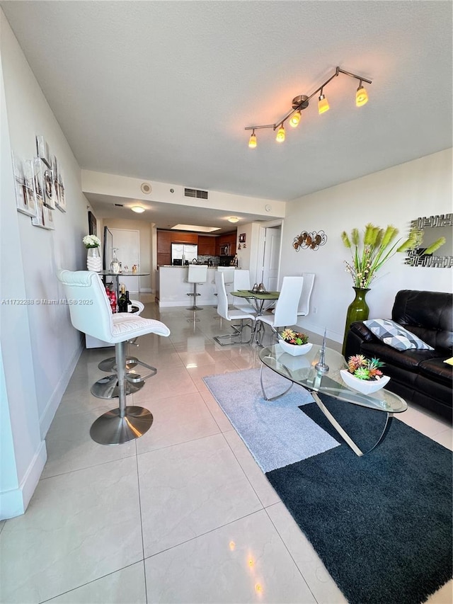 living room featuring light tile patterned flooring