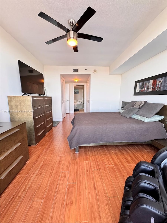 bedroom featuring light hardwood / wood-style floors and ceiling fan