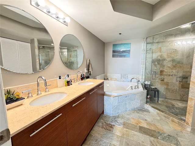 bathroom with vanity and separate shower and tub