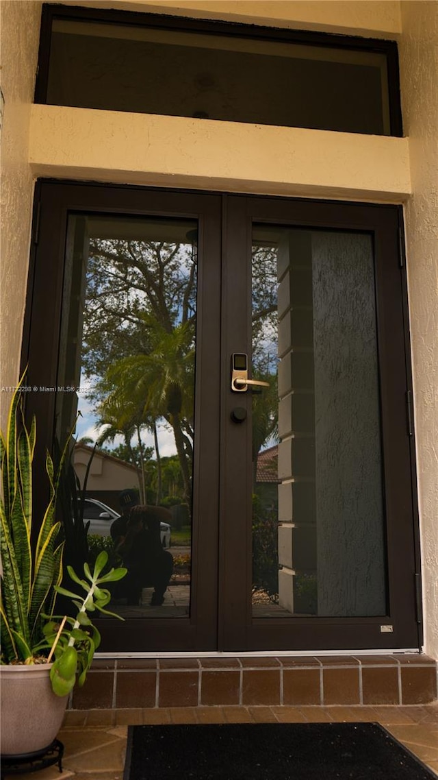 doorway to property featuring french doors