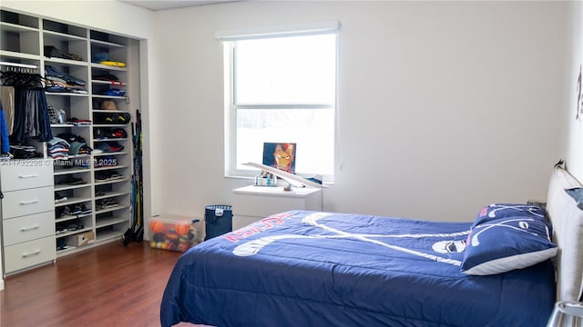 bedroom featuring dark hardwood / wood-style floors