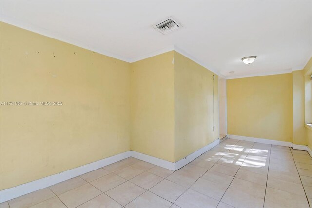 empty room with light tile patterned floors