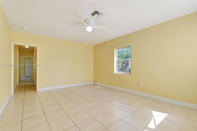 spare room featuring light tile patterned flooring