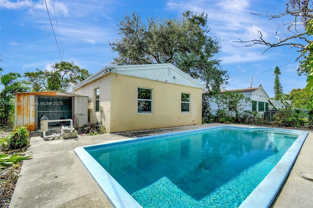 view of swimming pool with a patio area