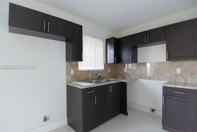 kitchen featuring sink and backsplash