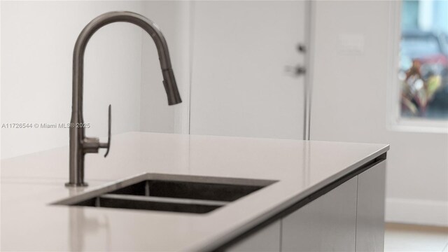 2555 NE 193rd St Unit 2102, Miami, FL 33180 - room details with white cabinetry and sink