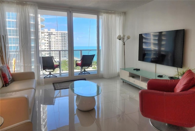 tiled living room featuring floor to ceiling windows and a healthy amount of sunlight