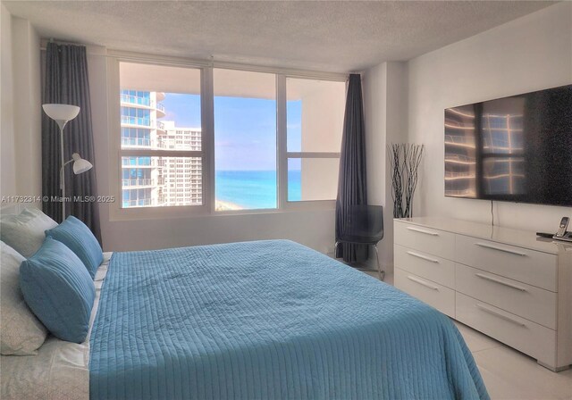 3505 S Ocean Dr Unit 1011, Hollywood, FL 33019 - bedroom with multiple windows and a textured ceiling