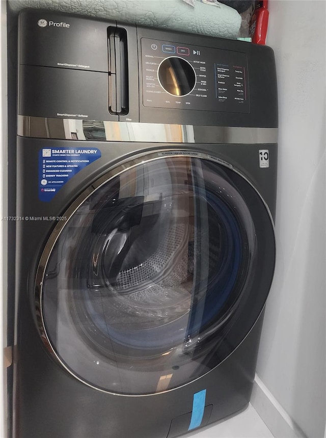 3505 S Ocean Dr Unit 1011, Hollywood, FL 33019 - washroom featuring washer / clothes dryer, laundry area, and baseboards