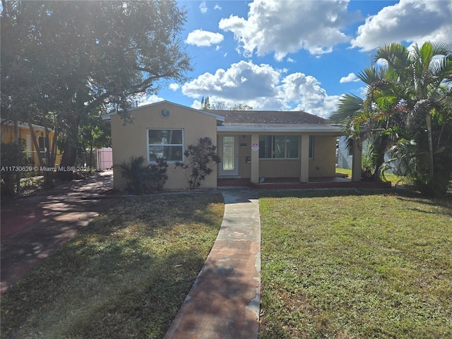 view of front of home with a front lawn