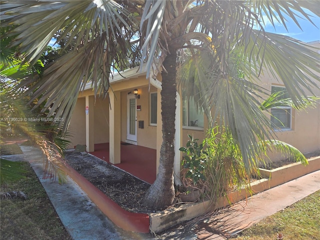 view of property exterior featuring a patio area