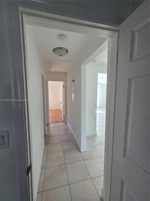 hallway featuring light tile patterned flooring