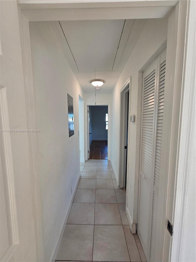 corridor featuring light tile patterned floors