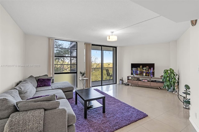 tiled living room featuring expansive windows