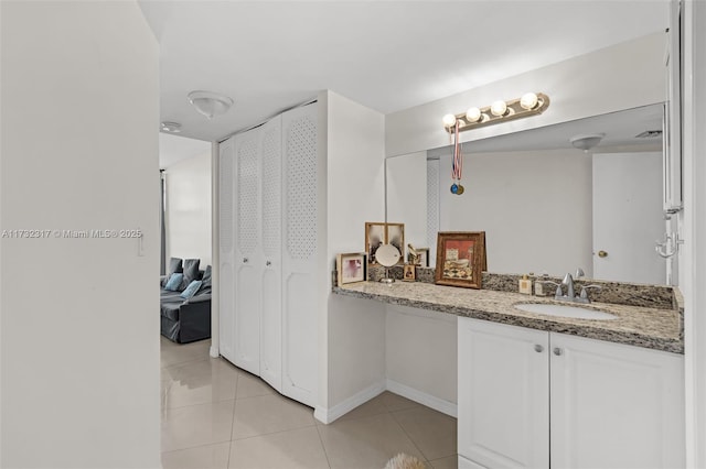 bathroom featuring tile patterned flooring and vanity