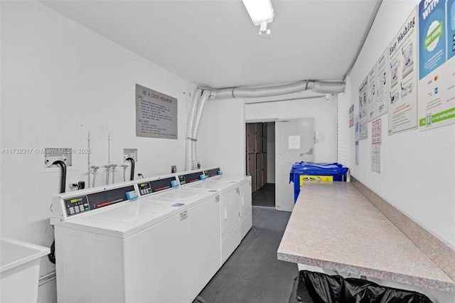 clothes washing area featuring washer and dryer