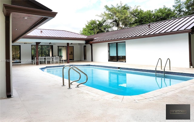 outdoor pool with ceiling fan, a patio, and outdoor dining space