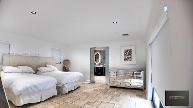 bedroom with stone tile flooring, visible vents, and recessed lighting