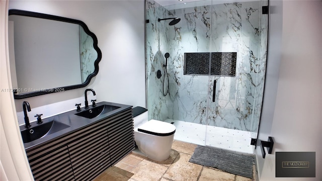 bathroom featuring stone tile flooring, a marble finish shower, toilet, and a sink