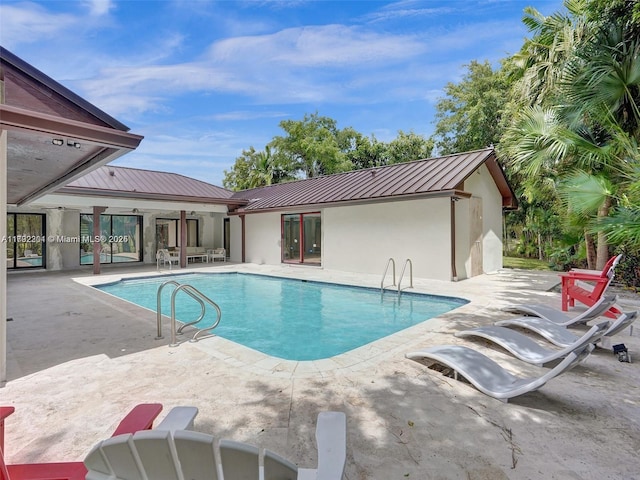 pool featuring a patio area