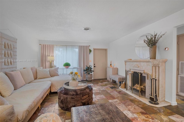 living room featuring a textured ceiling