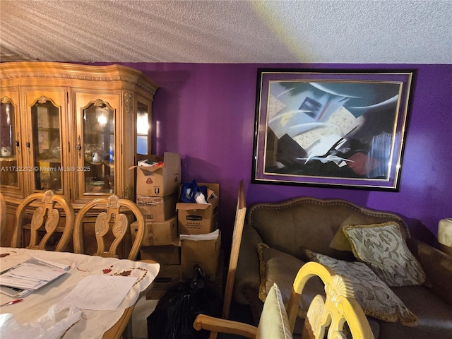 dining space with a textured ceiling