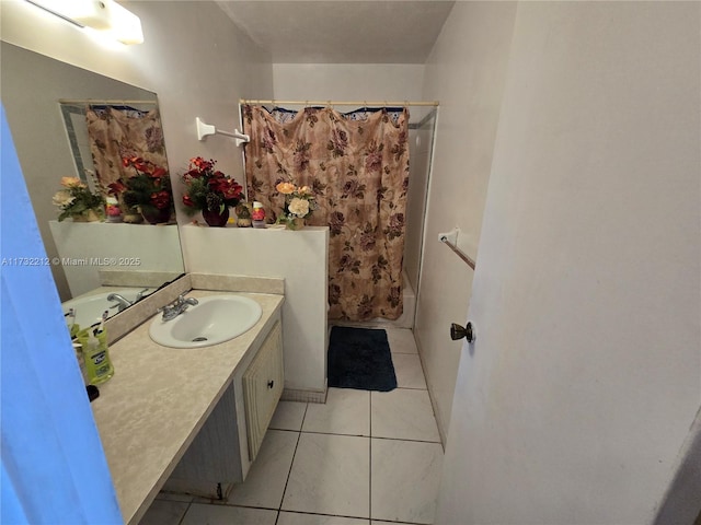 bathroom with tile patterned flooring, vanity, and shower / bath combo