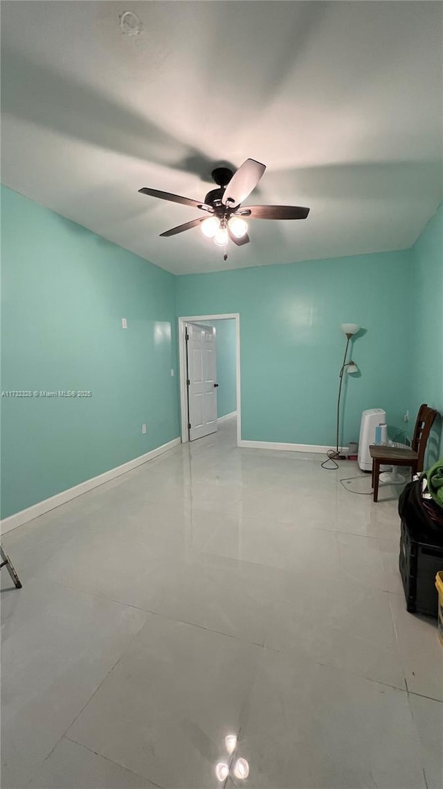 interior space featuring ceiling fan