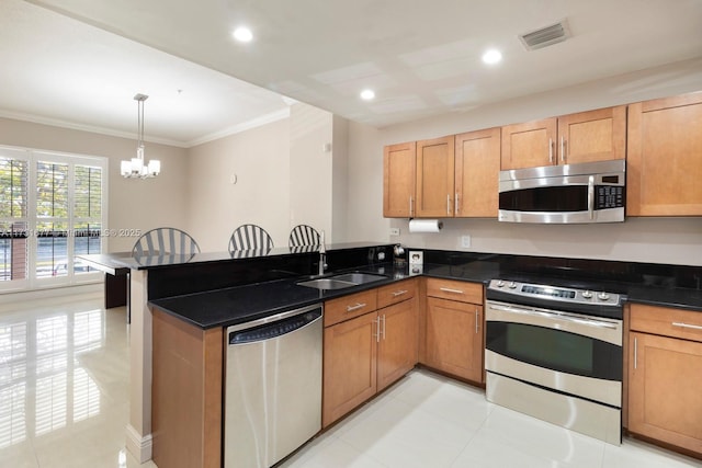 kitchen with sink, crown molding, kitchen peninsula, pendant lighting, and stainless steel appliances