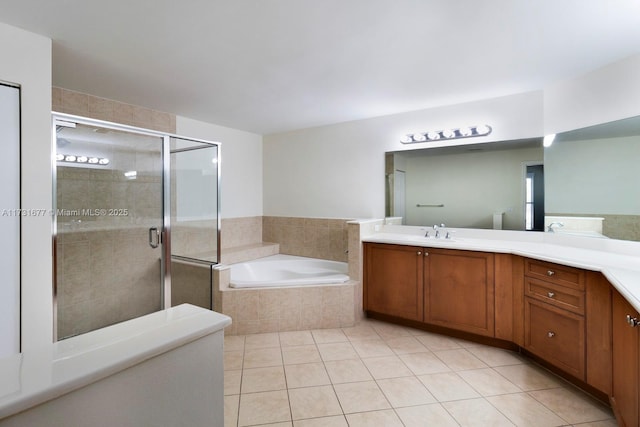 bathroom featuring vanity, tile patterned floors, and separate shower and tub