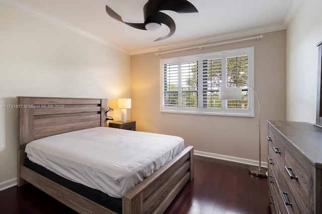 bedroom with crown molding, ceiling fan, and dark wood-type flooring