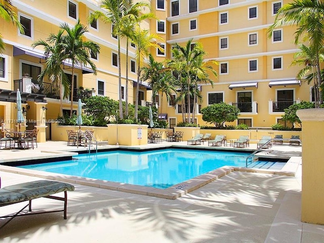 view of swimming pool with a patio