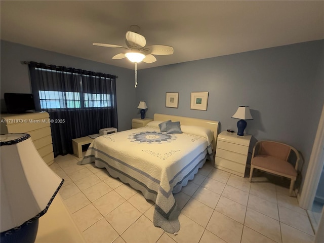 tiled bedroom featuring ceiling fan