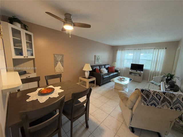 living room with ceiling fan and light tile patterned flooring