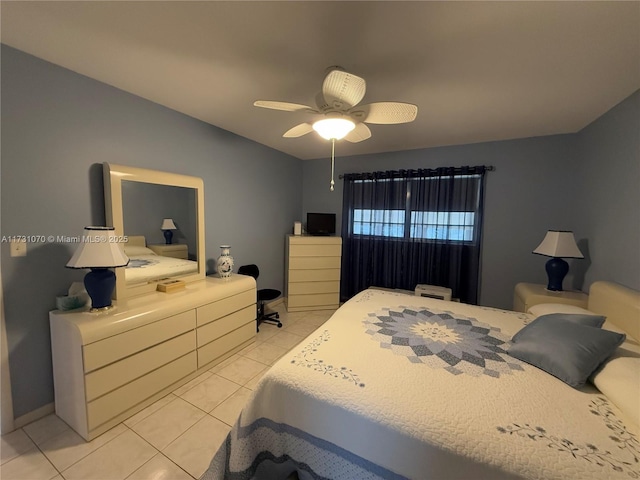 tiled bedroom featuring ceiling fan