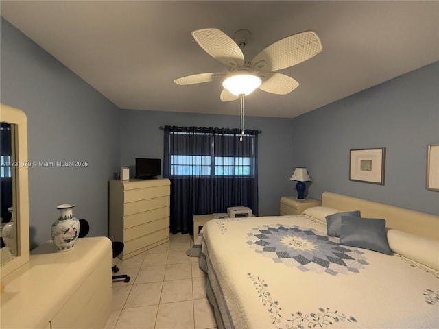 bedroom featuring light tile patterned floors and ceiling fan