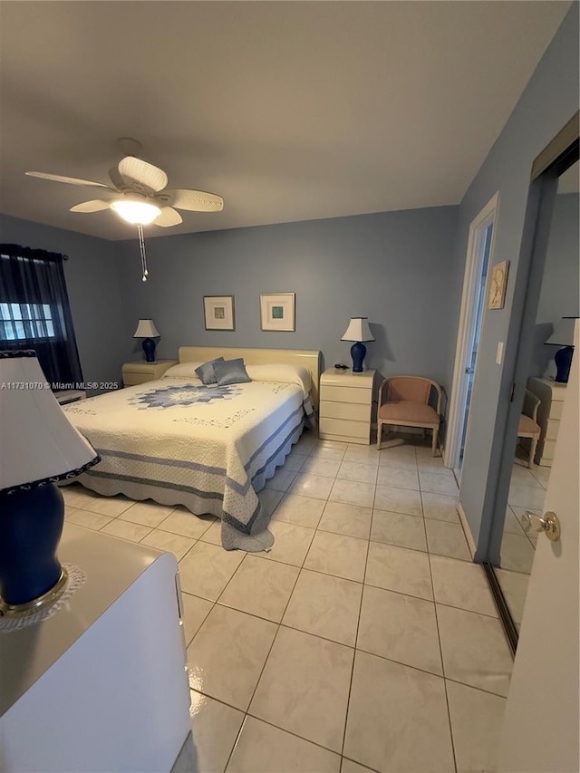 bedroom featuring light tile patterned floors and ceiling fan