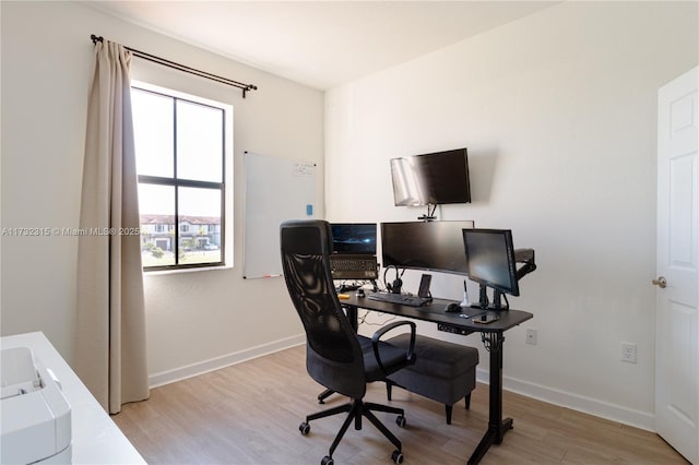 office area with light hardwood / wood-style floors